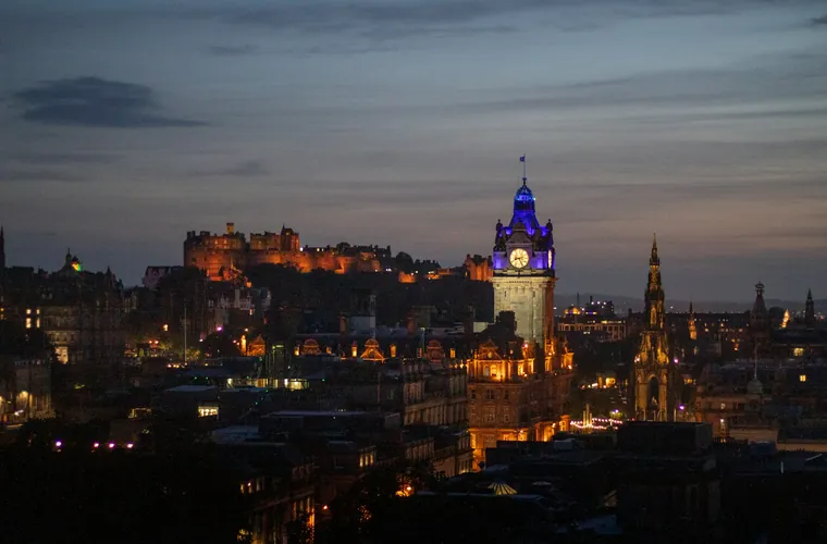 Edinburgh Castle and the city skyline at dusk — publishing services in Scotland
